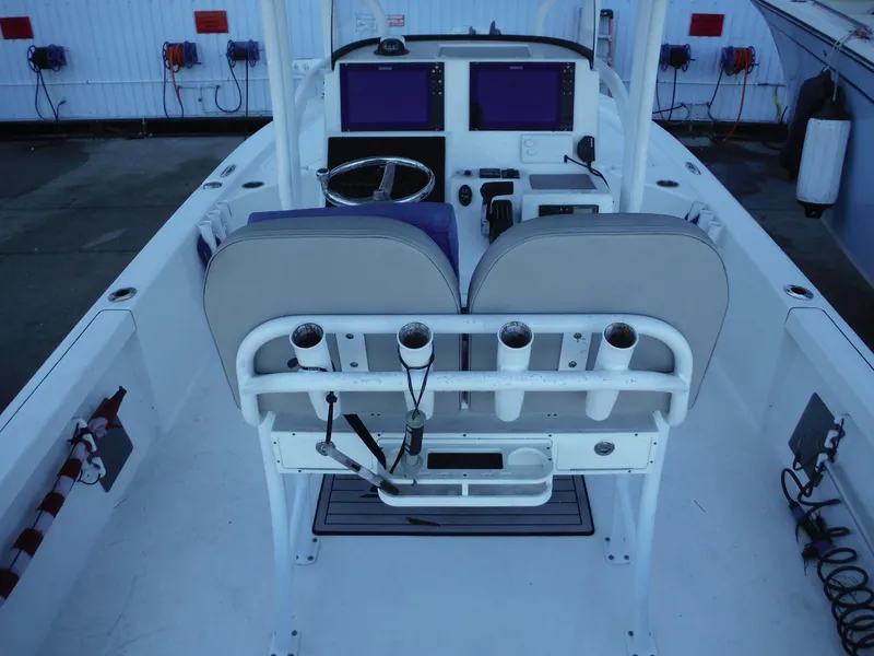 Slide: The Image of 2018 Sea Pro 248 Bay boat interior with dual seats and control panel. - 29