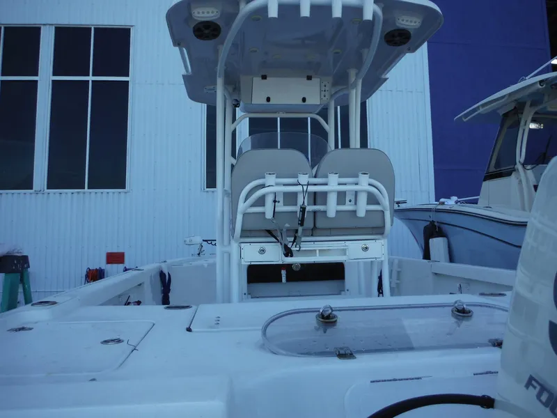Slide: The Image of 2018 Sea Pro 248 Bay boat interior with dual seats and center console. - 8