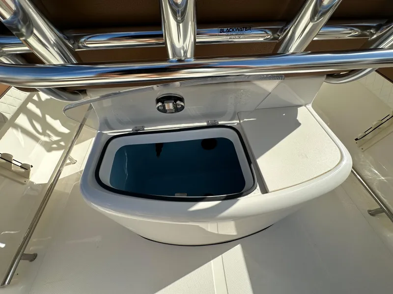 Slide: The Image of 2025 Pioneer 202 Sportfish boat livewell with stainless steel rod holders. - 11