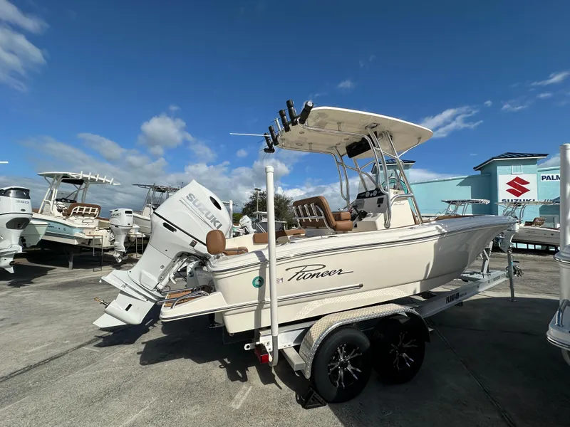 Slide: The Image of 2025 Pioneer 202 Sportfish boat on trailer under clear blue sky. - 3
