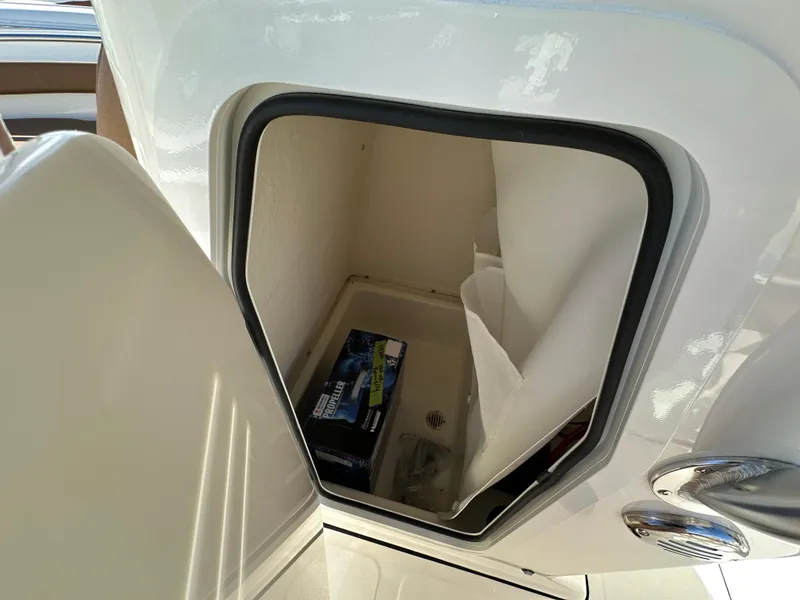 Slide: The Image of Open storage compartment in 2025 Pioneer 202 Sportfish boat. - 8