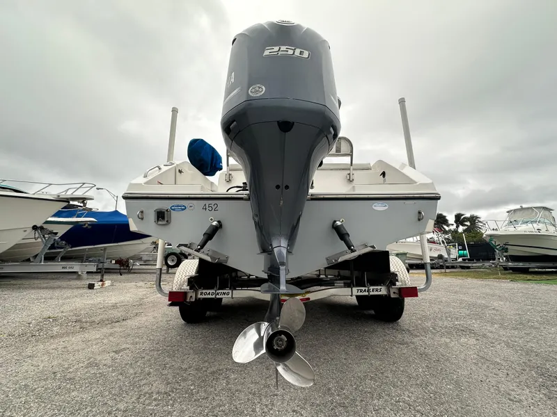 Slide: The Image of 2015 Century 2301 boat with powerful outboard motor on trailer. - 18
