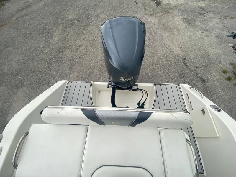Slide: The Image of Century 2301 boat, 2015 model, featuring a rear view with an outboard motor. - 19