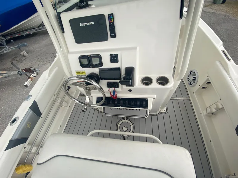 Slide: The Image of Century 2301 boat console, 2015 model, featuring steering wheel and Raymarine electronics. - 26