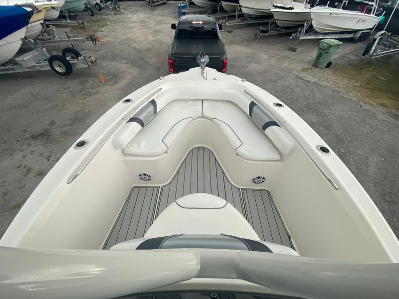 Slide: The Image of Century 2301 boat interior, 2015 model, with seating and deck view in a marina setting. - 31