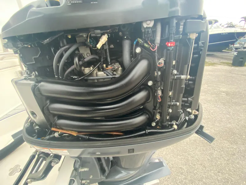 Slide: The Image of Close-up of a 2015 Century 2301 boat engine, showcasing intricate mechanical components. - 34