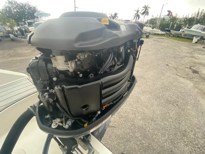 Slide: The Image of Open boat engine of a 2015 Century 2301, displayed outdoors. - 36