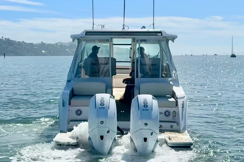 Slide: The Image of 2026 Tiara Yachts 34 LX cruising on a sunny day with twin engines. - 3