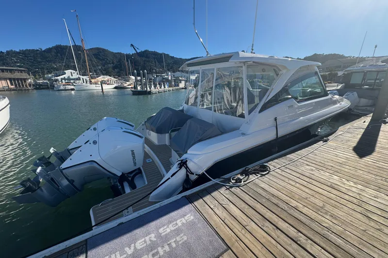 Slide: The Image of 2026 Tiara Yachts 34 LX docked, featuring dual Mercury outboard engines. - 61