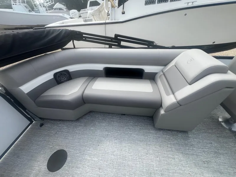 Slide: The Image of 2024 Premier 230 SunSation RF boat interior with gray seating and modern design. - 6