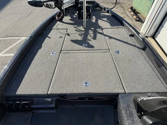 Slide: The Image of 2022 Phoenix 721 Pro XP boat deck with carpeted surface and storage compartments. - 12