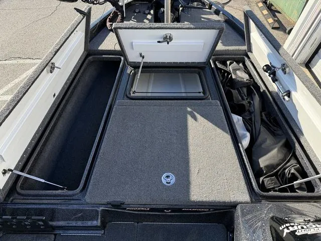 Slide: The Image of 2022 Phoenix 721 Pro XP boat storage compartments open, showcasing spacious interior layout. - 13