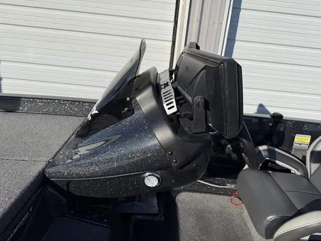 Slide: The Image of 2022 Phoenix 721 Pro XP boat dashboard with steering wheel and electronics. - 16