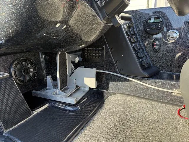 Slide: The Image of 2022 Phoenix 721 Pro XP boat interior with control panel and foot pedal. - 17