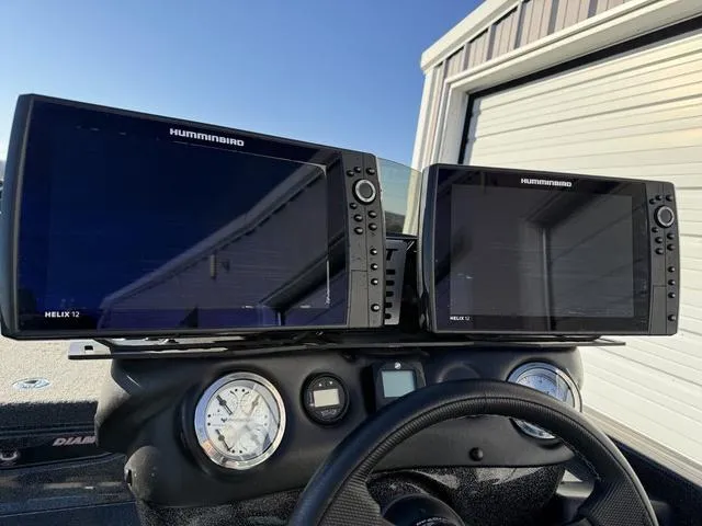 Slide: The Image of 2022 Phoenix 721 Pro XP dashboard with dual Humminbird Helix 12 fish finders. - 19