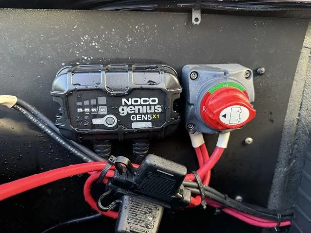 Slide: The Image of NOCO Genius GEN5X1 charger and switch in Phoenix 721 Pro XP, 2022 model. - 27