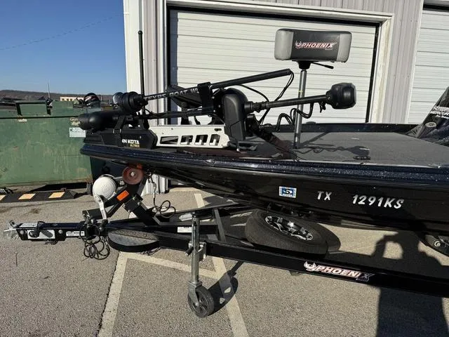 Slide: The Image of 2022 Phoenix 721 Pro XP boat on trailer, parked outside a garage. - 5
