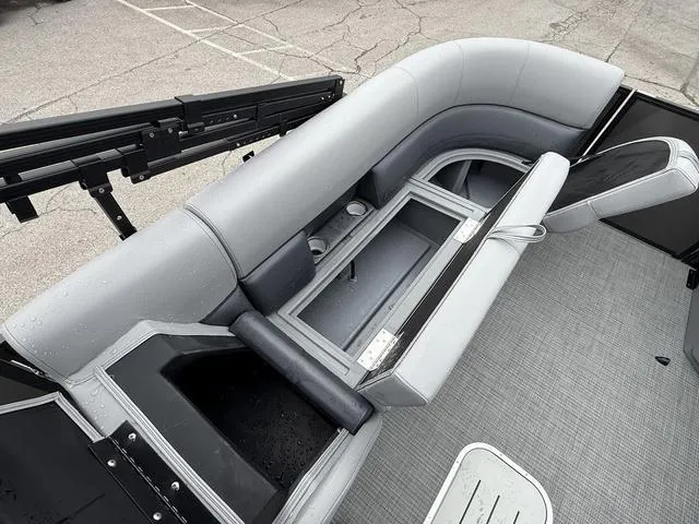 Slide: The Image of 2025 Bentley Pontoons Legacy 243 Navigator interior with gray seating and storage compartments. - 10