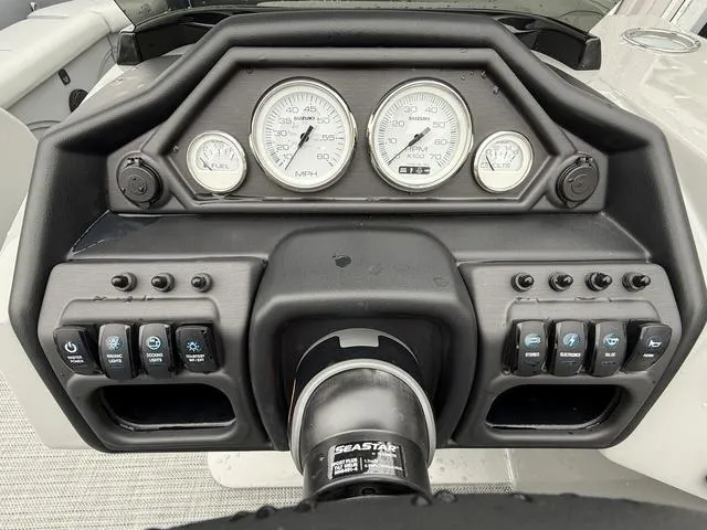 Slide: The Image of Dashboard of 2025 Bentley Pontoons Legacy 243 Navigator with gauges and controls. - 13