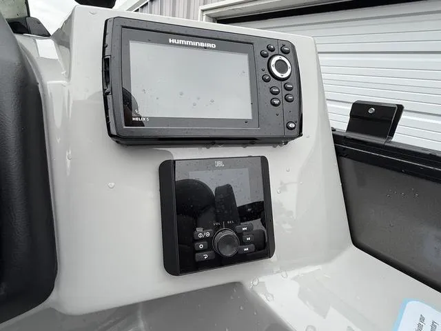 Slide: The Image of 2025 Bentley Pontoons Legacy 243 Navigator dashboard with Humminbird and JBL controls. - 14