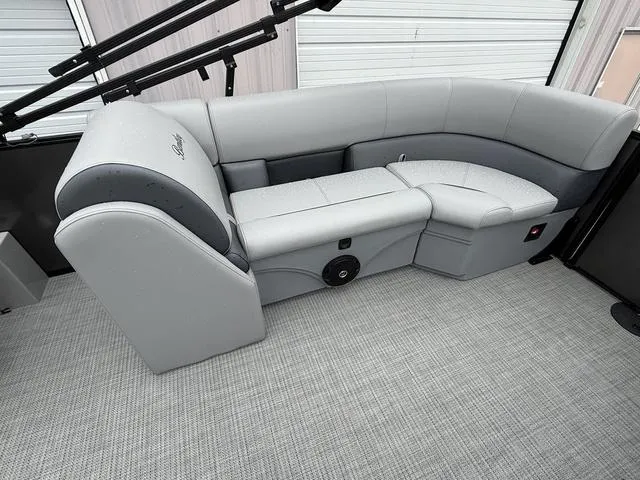 Slide: The Image of 2025 Bentley Pontoons Legacy 243 Navigator interior seating, featuring sleek gray upholstery. - 18