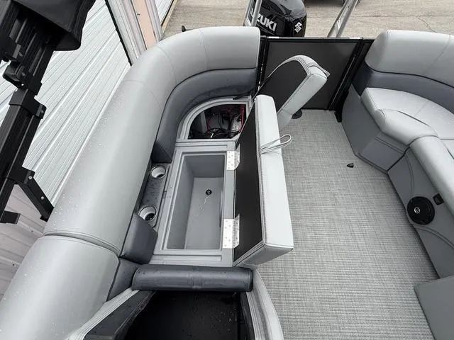 Slide: The Image of 2025 Bentley Pontoons Legacy 243 Navigator interior with seating and storage compartments. - 19