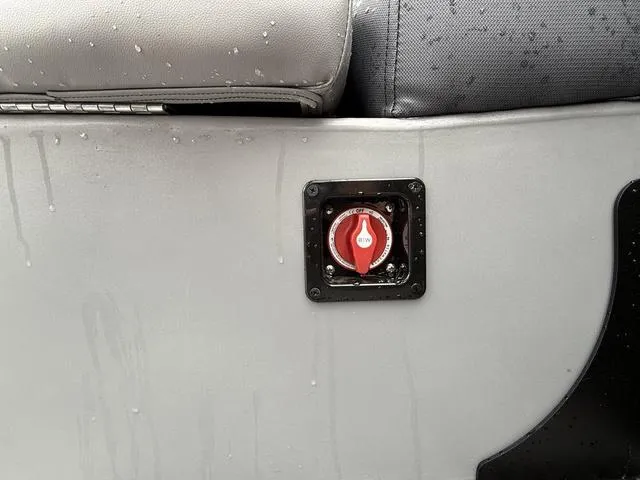 Slide: The Image of Close-up of a 2025 Bentley Pontoons Legacy 243 Navigator switch panel with water droplets. - 22