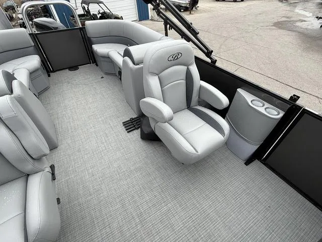 Slide: The Image of 2025 Bentley Pontoons Legacy 243 Navigator interior with plush seating and modern design. - 24
