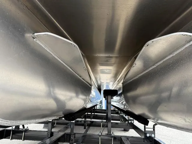 Slide: The Image of Underneath view of 2025 Bentley Pontoons Legacy 243 Navigator, showcasing sleek aluminum pontoons. - 7