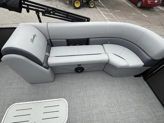 Slide: The Image of 2025 Bentley Pontoons Legacy 243 Navigator interior with gray seating and spacious layout. - 9
