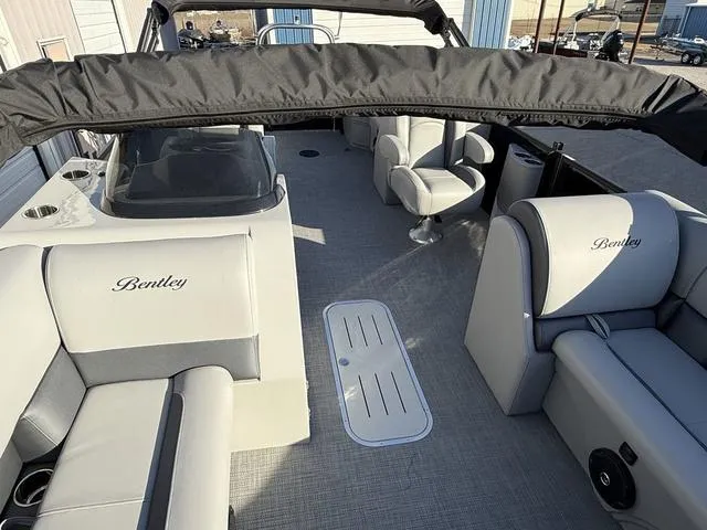Slide: The Image of 2025 Bentley Pontoons Legacy 223 Navigator interior with plush seating and modern design. - 12