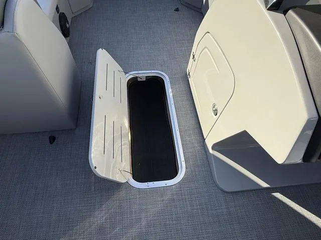 Slide: The Image of 2025 Bentley Pontoons Legacy 223 Navigator storage compartment on deck. - 13