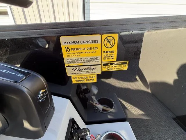 Slide: The Image of 2025 Bentley Pontoons Legacy 223 Navigator capacity warning label, 15 persons or 2480 lbs. - 19