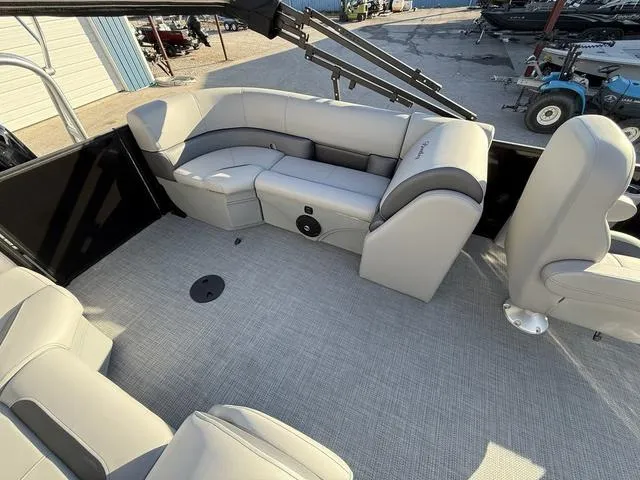 Slide: The Image of 2025 Bentley Pontoons Legacy 223 Navigator interior with plush seating and modern design. - 23