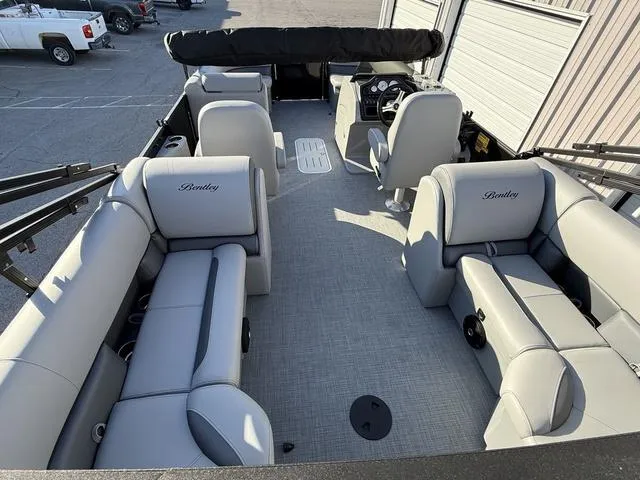Slide: The Image of 2025 Bentley Pontoons Legacy 223 Navigator interior with luxurious seating and modern design. - 27