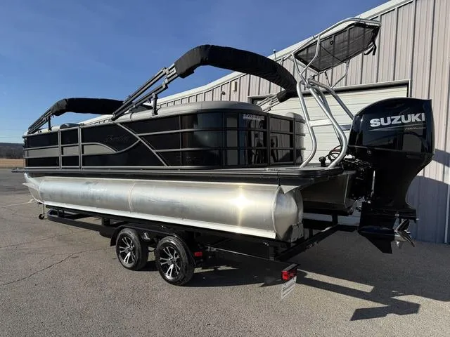 Slide: The Image of 2025 Bentley Pontoons Legacy 223 Navigator with Suzuki engine, parked on a trailer. - 3