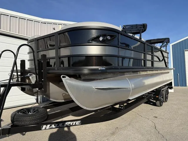 Slide: The Image of 2025 Bentley Pontoons Legacy 223 Navigator on trailer, parked outdoors. - 6