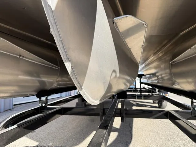 Slide: The Image of 2025 Bentley Pontoons Legacy 223 Navigator undercarriage view on trailer. - 8