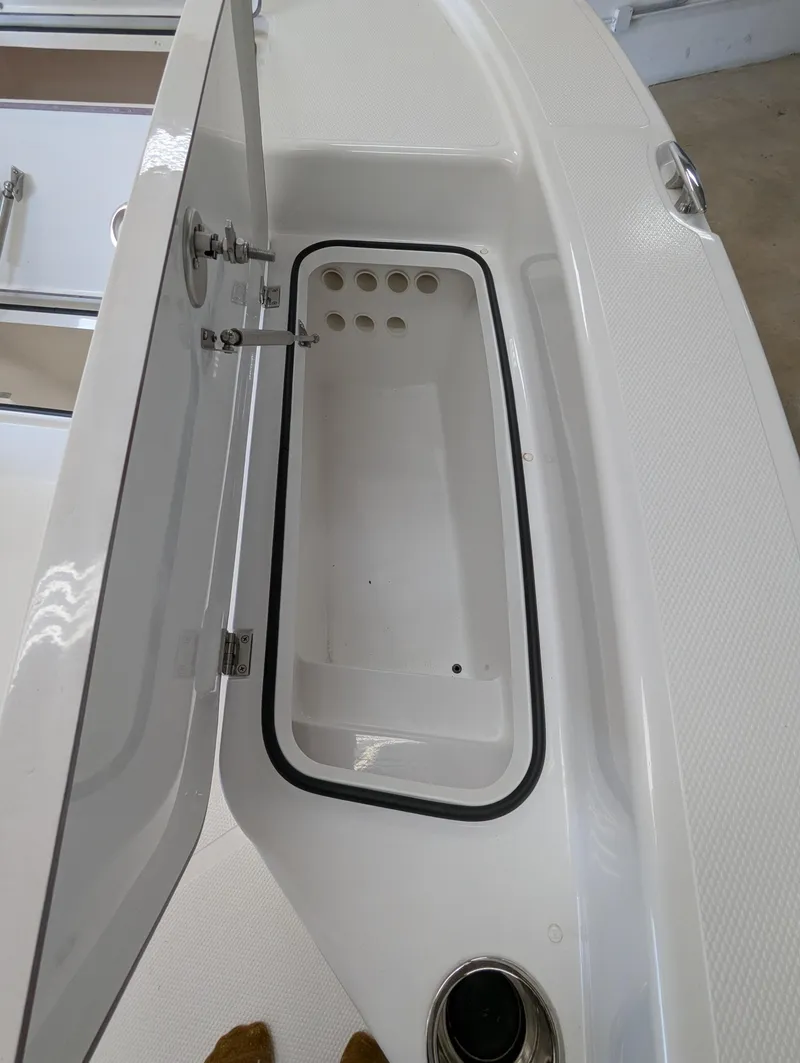 Slide: The Image of Open storage compartment on 2025 BlackJack 224 boat. - 18