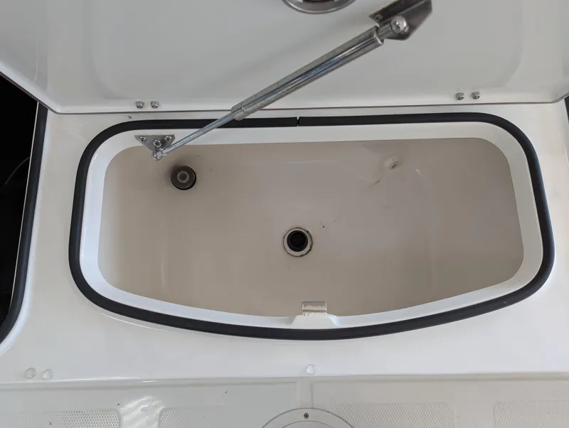 Slide: The Image of Open storage compartment in BlackJack 224 boat, 2025 model. - 20