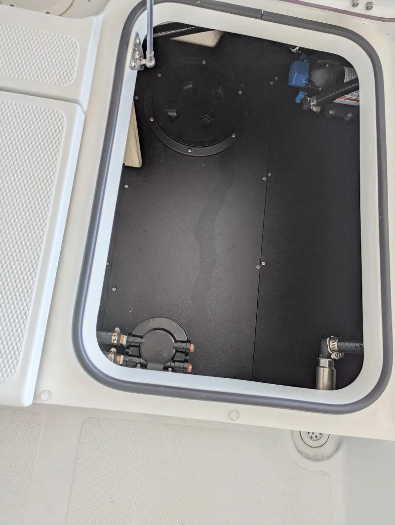 Slide: The Image of Open storage compartment in 2025 BlackJack 224 boat. - 21