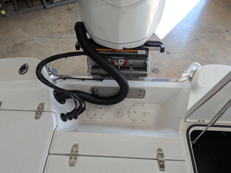 Slide: The Image of 2025 BlackJack 224 boat engine compartment with wiring and fittings. - 23
