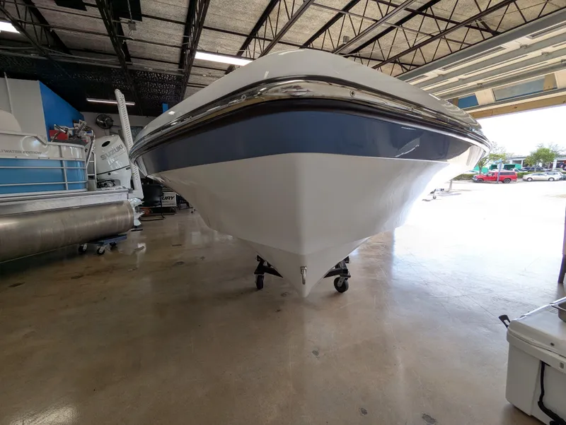 Slide: The Image of 2025 BlackJack 224 boat in showroom, front view. - 5