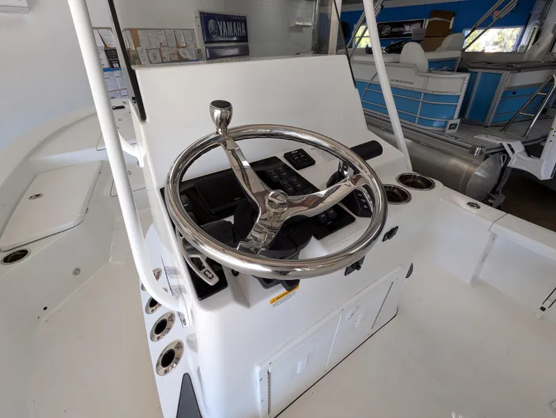 Slide: The Image of BlackJack 224 boat steering console, 2025 model, featuring a sleek chrome wheel and control panel. - 8