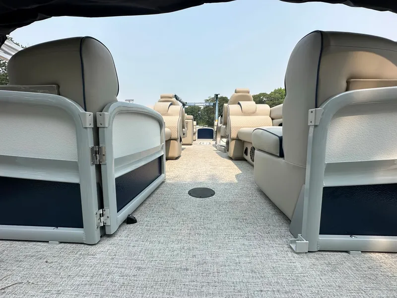 Slide: The Image of 2023 Premier 250 Solaris RF pontoon boat interior with spacious seating and modern design. - 3
