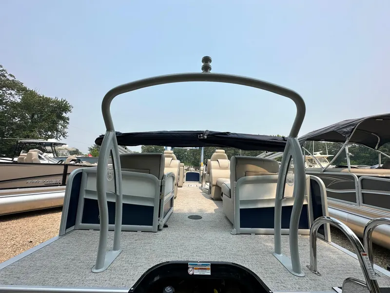Slide: The Image of 2023 Premier 250 Solaris RF pontoon boat with spacious seating and sleek design. - 4
