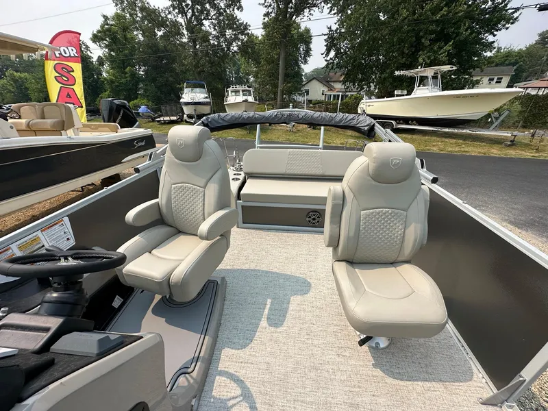 Slide: The Image of 2023 Premier 250 Solaris RL boat interior with plush seating and modern design. - 10