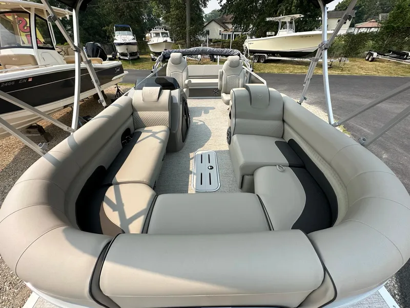 Slide: The Image of 2023 Premier 250 Solaris RL pontoon boat with spacious seating and modern design. - 4