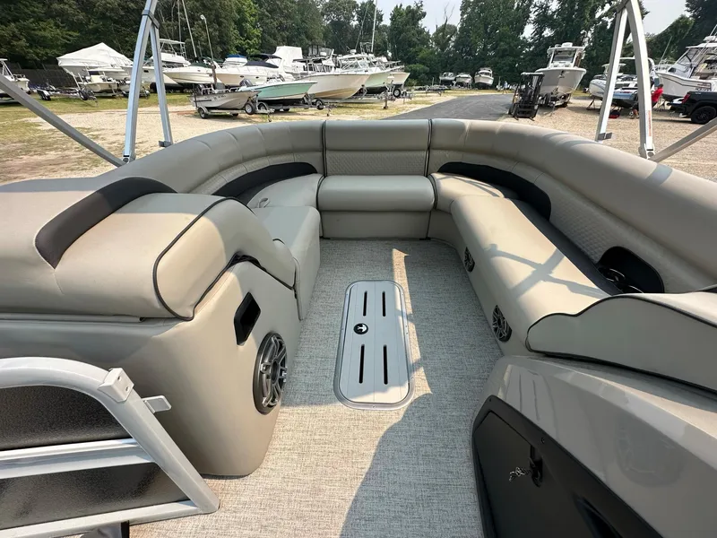 Slide: The Image of 2023 Premier 250 Solaris RL pontoon boat interior with spacious seating and modern design. - 6
