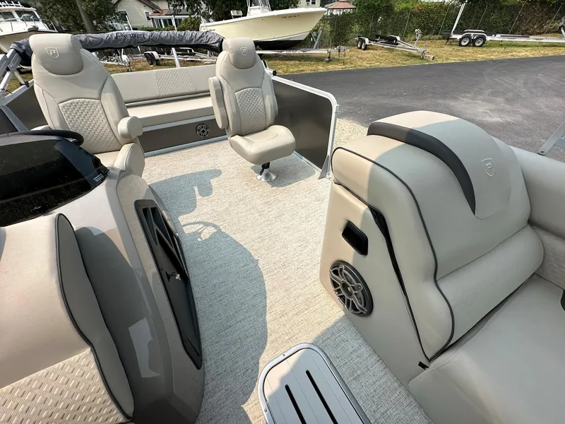 Slide: The Image of 2023 Premier 250 Solaris RL boat interior with plush seating and modern design. - 9